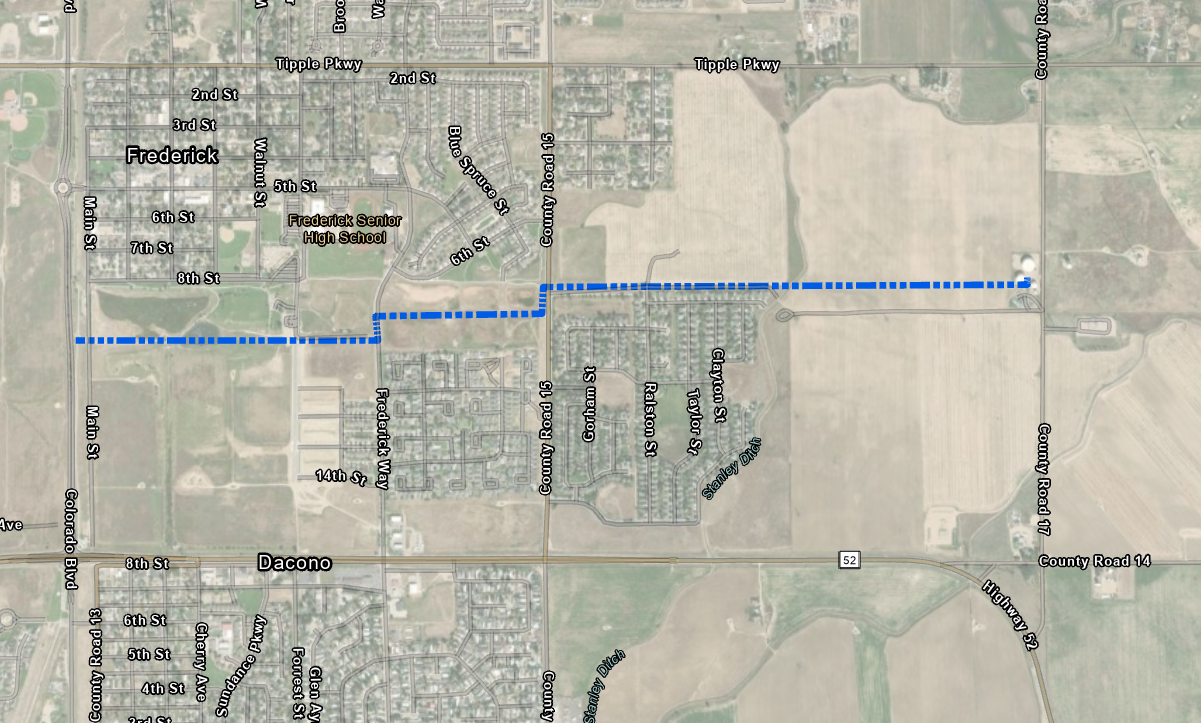 A satellite map of Frederick, CO, with a blue dashed route crossing the town.